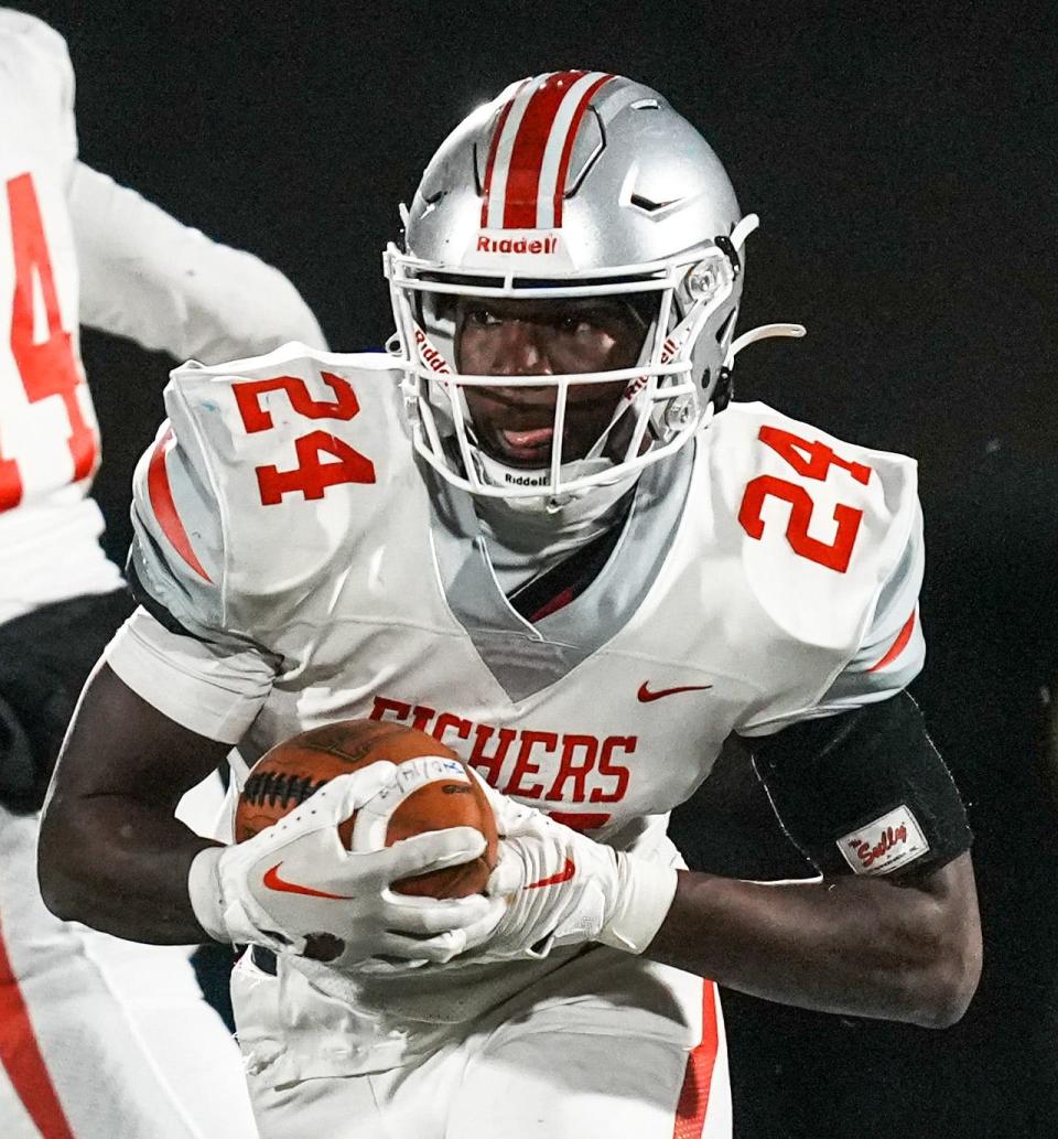 Fishers Tigers running back Khobie Martin (24) on the carry during the final game of class 6A sectionals between Fishers Tigers and Hamilton Southeastern Royals on Friday, Nov. 3, 2023, at Hamilton Southeastern High School in Fishers. Hamilton Southeastern Royals will move on to regionals after beating Fishers Tigers 38-21.