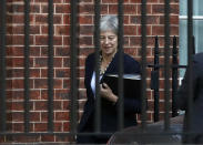 Britain's Prime Minister Theresa May leaves 10 Downing Street to give a statement to parliament in London, Monday, Oct. 22, 2018. May is urging Parliament to support her as Brexit looms, saying a divorce deal with the European Union is 95 percent complete. (AP Photo/Frank Augstein)