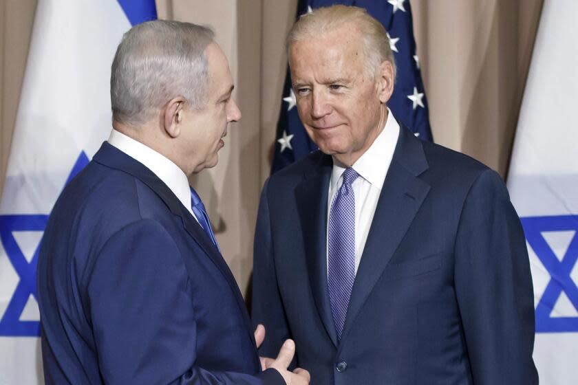 FILE - Israeli Prime Minister Benjamin Netanyahu, left, and Vice President Joe Biden talk prior to a meeting on the sidelines of the World Economic Forum in Davos, Switzerland, Jan. 21, 2016. President Joe Biden spoke Sunday, March 19, 2023, with Israeli Prime Minister Benjamin Netanyahu to "express concern" over his government's planned overhaul of the country's judicial system that has sparked widespread protests across Israel and to encourage compromise. (AP Photo/Michel Euler, File)