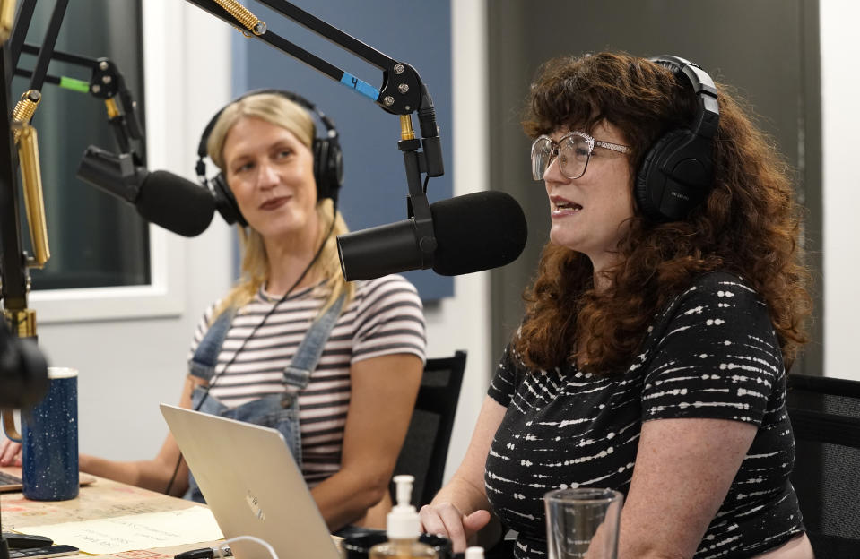 Tess Barker, left, and Barbara Gray, co-hosts of the "Britney's Gram" podcast, talk in the Earwolf podcast studio, Thursday, July 15, 2021, in Los Angeles. (AP Photo/Chris Pizzello)