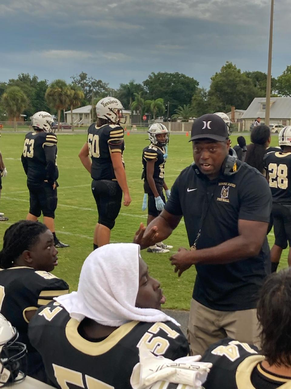 Former Pahokee football head coach Emmanuel Hendrix leads his players as defensive coordinator for Moore Haven during a preseason Kickoff Classic game against Glades Central on Aug. 18, 2023 in Moore Haven.