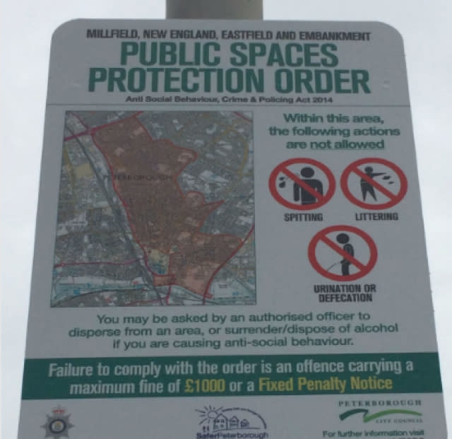 Public signs warn people not to defecate in Peterborough