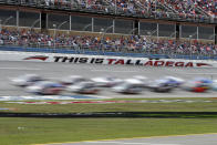 Trucks pass through the tai-oval during the Sugarlands Shine 250 at Talladega Superspeedway, Saturday, Oct 12, 2019, in Talladega, Ala. (AP Photo/Butch Dill)