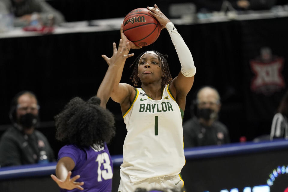 FILE - Baylor forward NaLyssa Smith (1) shoots over TCU guard Tavy Diggs (13) during the first half of an NCAA college basketball game in the quarterfinal round of the Big 12 Conference tournament in Kansas City, Mo., in this Friday, March 12, 2021, file photo. Smith was named to the preseason Associated Press NCAA college basketball All-America team on Tuesday, Oct. 26, 2021. (AP Photo/Orlin Wagner, File)