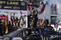 Tyler Reddick reacts after winning the Kwik Trip 250 after a NASCAR Cup Series auto race Sunday, July 3, 2022, at Road America in Elkhart Lake, Wis. (AP Photo/Morry Gash)