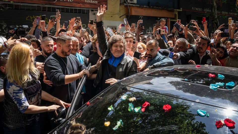 Milei greets supporters before voting during general elections in Buenos Aires, Argentina, Sunday, Oct. 22, 2023. - Rodrigo Abd/AP