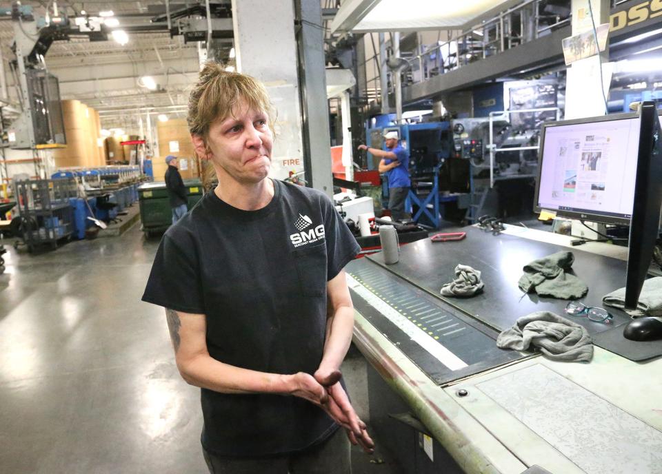 Sharan Moore talks with emotion Sunday, March 19, 2023, about the last 25 years she has been in the camera room and operating the printing press at Seacoast Media Group in Portsmouth. The day marked the last printing of Foster's Daily Democrat and the Portsmouth Herald in Portsmouth. The local papers will now be printed in Auburn, Massachusetts, and Providence, Rhode Island.