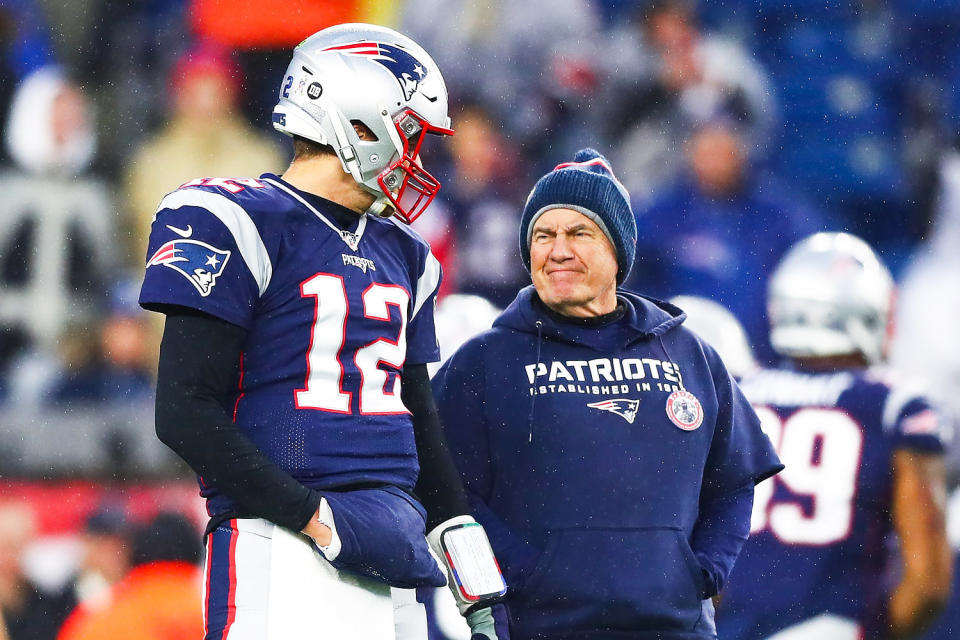 Tom Brady #12 talks to head coach Bill Belichick  (Adam Glanzman / Getty Images)