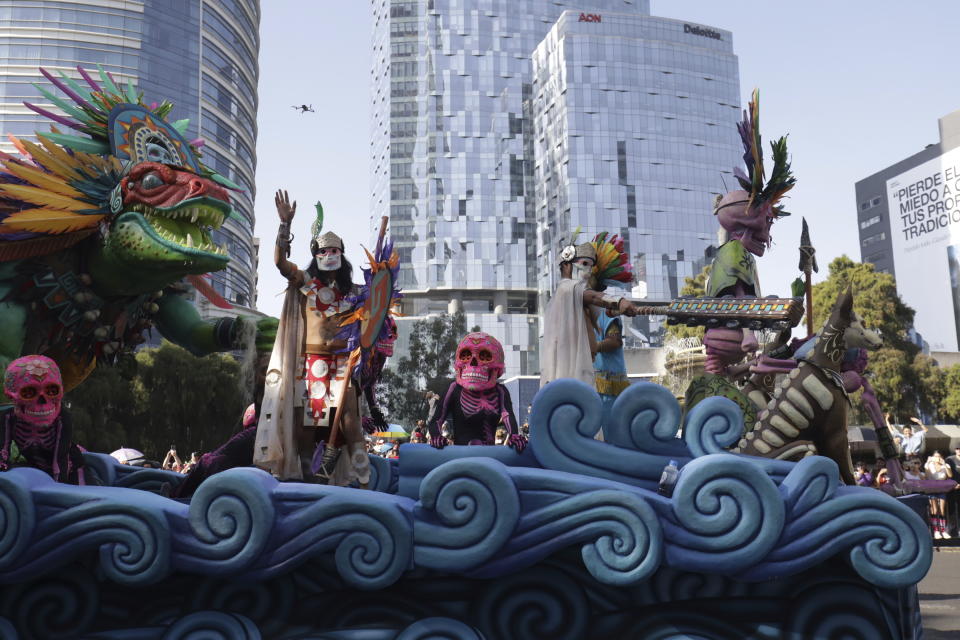 Participants take part in a James Bond-inspired Day of the Dead Parade, in Mexico City, Saturday, Nov. 4, 2023. The Hollywood-style parade was adopted in 2016 by Mexico City to mimic a fictitious march in the 2015 James Bond movie “Spectre.” (AP Photo/Ginnette Riquelme)