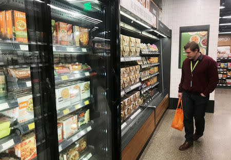 A customer browses meal-kit options at Amazon's new "grab-and-go" store in Seattle, Washington, U.S., January 18, 2018. Photo taken January 18, 2018. REUTERS/Jeffrey Dastin