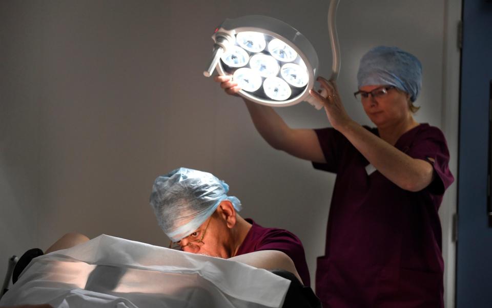 Dr Amin Gorgy, carries out an examination at the Fertility and Gynaecological Centre in London - Credit: Julian Simmonds