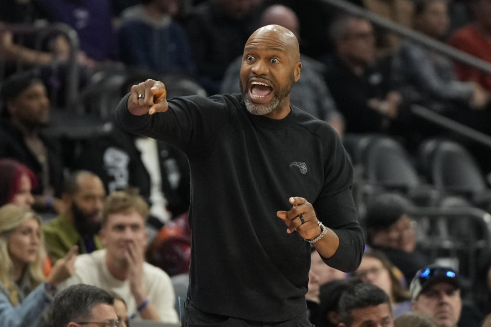 Orlando Magic head coach Jamahl Mosley reacts after a call during the first half of an NBA basketball game against the Phoenix Suns, Sunday, Dec. 31, 2023, in Phoenix. (AP Photo/Rick Scuteri)