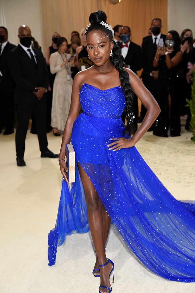 Amanda Gorman in a Vera Wang gown and Edie Parker clutch. - Credit: AP Images