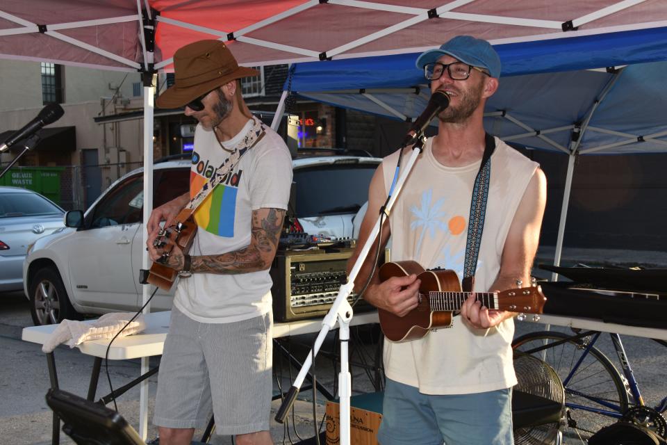 Local musicians Aaron Hamilton and Brian Avet perform during Cajun Linen Night in downtown Thibodaux Aug. 11.