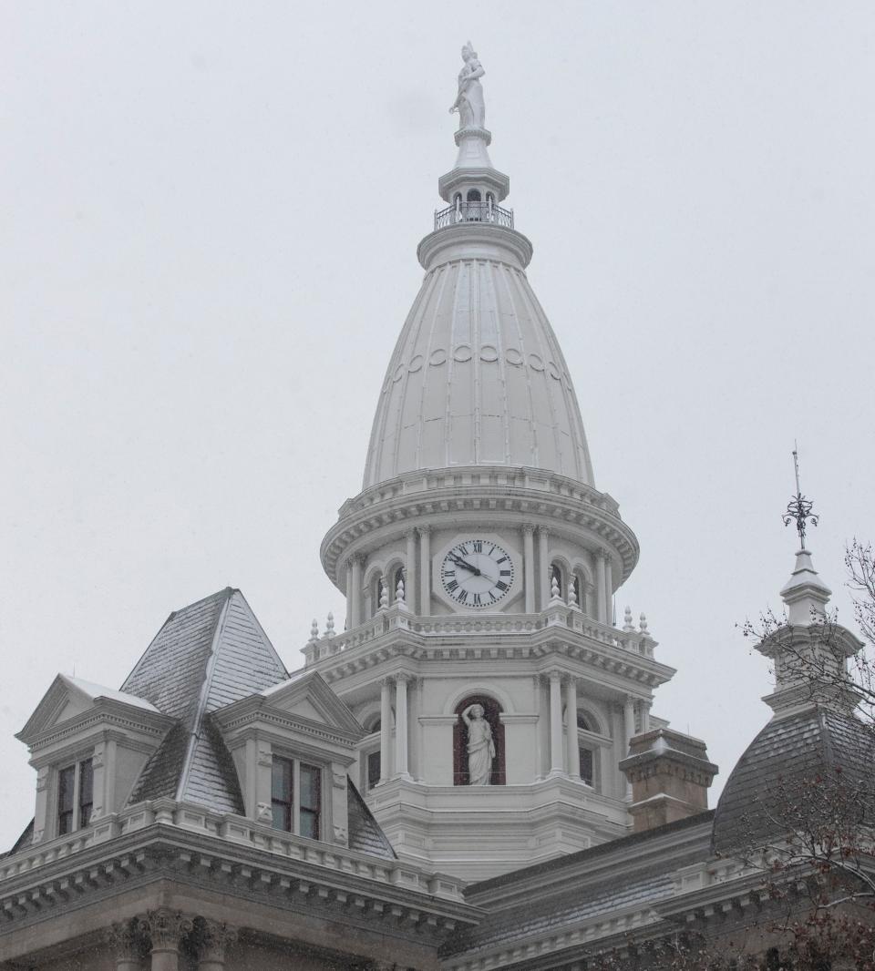 Snow falls onto the Tippecanoe County Courthouse, Wednesday, Jan. 25, 2023, in Lafayette, Ind. 