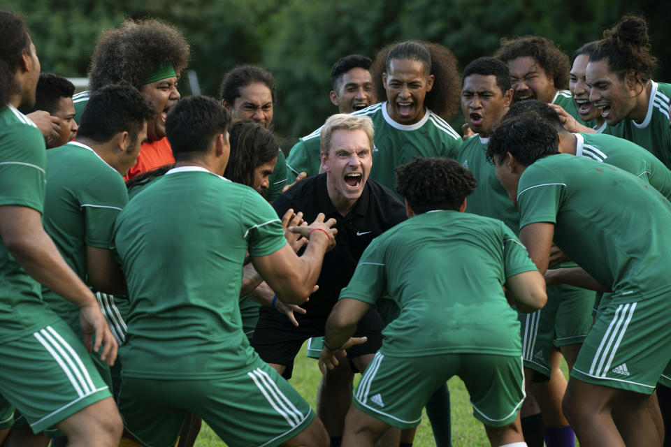 This image released by Searchlight Pictures shows Michael Fassbender, center, in a scene from "Next Goal Wins," which will have its world premiere at the Toronto International Film Festival this fall. (Hilary Bronwyn Gayle/Searchlight Pictures via AP)