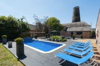 <p>With its own outdoor swimming pool in a large garden, this Airbnb windmill has summer written all over it. The sprawling holiday home has a main house and a mill tower with seven floors, including seven bedrooms, a games barn, a circular dining room and a seventh-floor viewing platform so you can take in the panoramic views of the Norfolk countryside.</p><p><strong>Sleeps:</strong> 15</p><p><a class="link " href="https://airbnb.pvxt.net/n1znZx?trafcat=summer" rel="nofollow noopener" target="_blank" data-ylk="slk:CHECK AVAILABILITY;elm:context_link;itc:0;sec:content-canvas">CHECK AVAILABILITY</a></p>