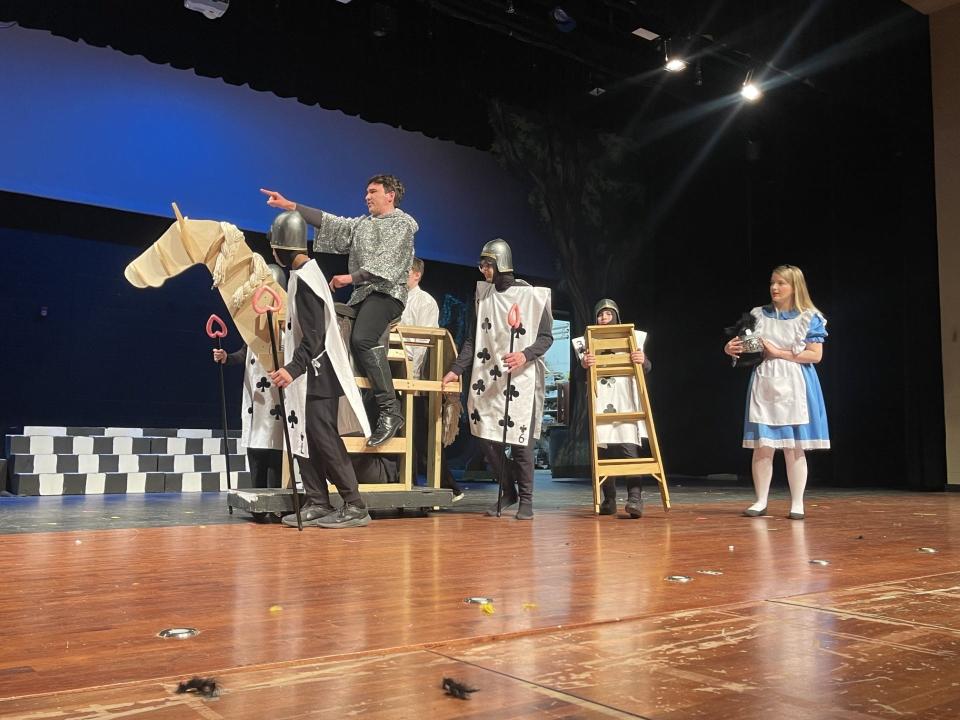 The White Knight, left, played by James Trombka, leads Alice, played by Elizabeth Jordan, in a scene from the play "Alice in Wonderland.