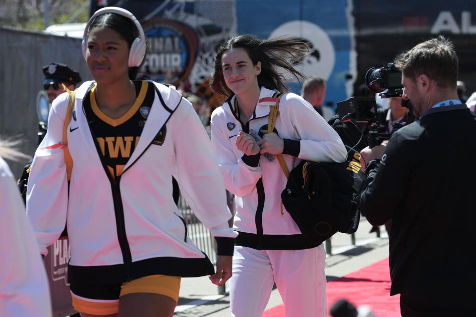 Iowa's Jada Gyamfi, left, and Caitlin Clark arrive for the NCAA Women's Final Four championship basketball game against South Carolina, Sunday, April 7, 2024, in Cleveland. (AP Photo/Carolyn Kaster)