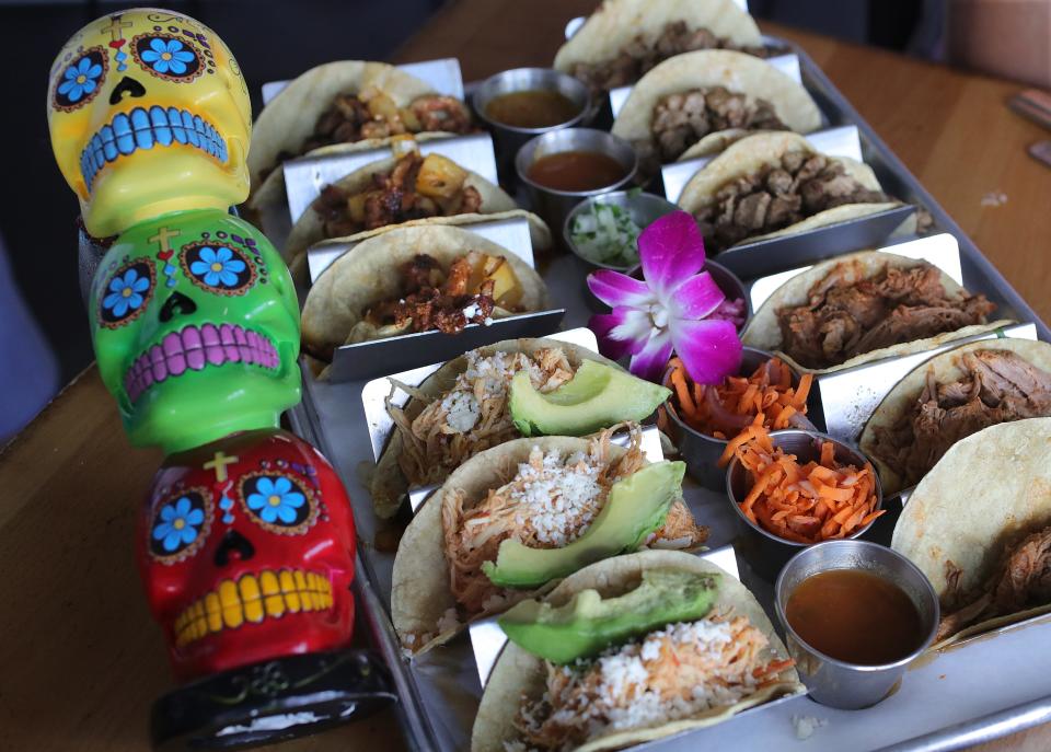 Blue Habanero's $55 variety taco tray comes with your choice of 4 types of tacos, 12 total, with 4 sides of Mexican rice, cilantro white rice, black beans, and refried beans on Friday, July 22, 2022 in Brecksville.