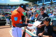 <p>Miami Marlins prospect Brian Anderson signs autographs for fans before the baseball game against the New York Mets at Roger Dean Chevrolet Stadium in Jupiter, Fl., March 3, 2018. (Photo: Gordon Donovan/Yahoo News) </p>