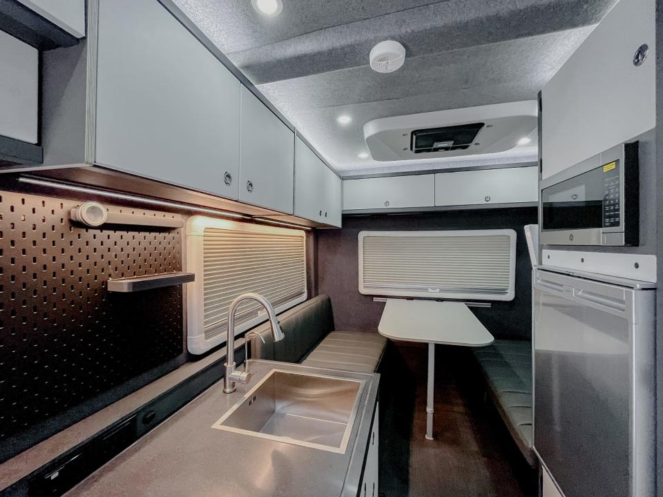 inside the RexRover with a kitchen, dinette