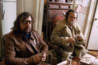 <p>Rip Torn, decked out in shearling, lights up in his New York apartment in February 1973. </p>