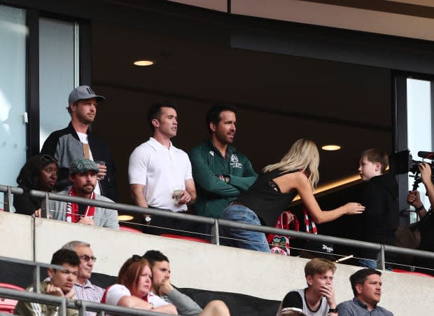 Wrexham owners Rob McElhenney and Ryan Reynolds watch during the FA Trophy Final between Bromley and Wrexham at Wembley Stadium on May 22, 2022, in London.<p><a href="https://www.gettyimages.com/detail/1240835485" rel="nofollow noopener" target="_blank" data-ylk="slk:Ben Peters/MB Media/Getty Images" class="link ">Ben Peters/MB Media/Getty Images</a></p>
