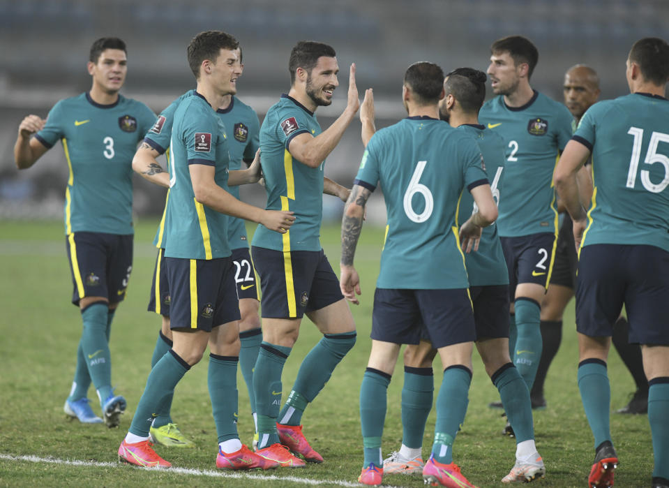 Australia's players celebrate after a goal during the World Cup 2022 Group B qualifying soccer match between Nepal and Australia in Kuwait City, Kuwait, Friday. June 11, 2021. (AP Photo/Jaber Abdulkhaleg)