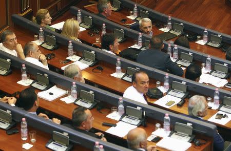 Kosovar Members of Parliament sit in the Assembly during a summer session in Pristina, Kosovo August 3, 2015. REUTERS/Hazir Reka