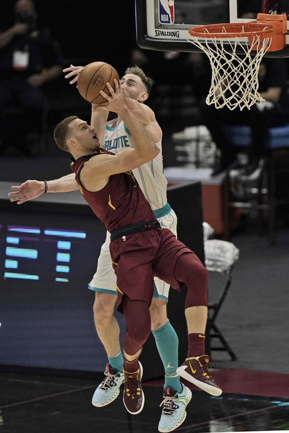 Cleveland Cavaliers' Dylan Windler drives to the basket in the second half of an NBA basketball game against the Charlotte Hornets, Wednesday, Dec. 23, 2020, in Cleveland. Windler broke his left hand on this play in the season opener, another medical setback for a promising player. The team said Thursday that Windler suffered a fourth metacarpal fracture when he took a hard fall in the third quarter against Charlotte. X-rays after the game were negative, but further tests revealed the fracture. (AP Photo/Tony Dejak)