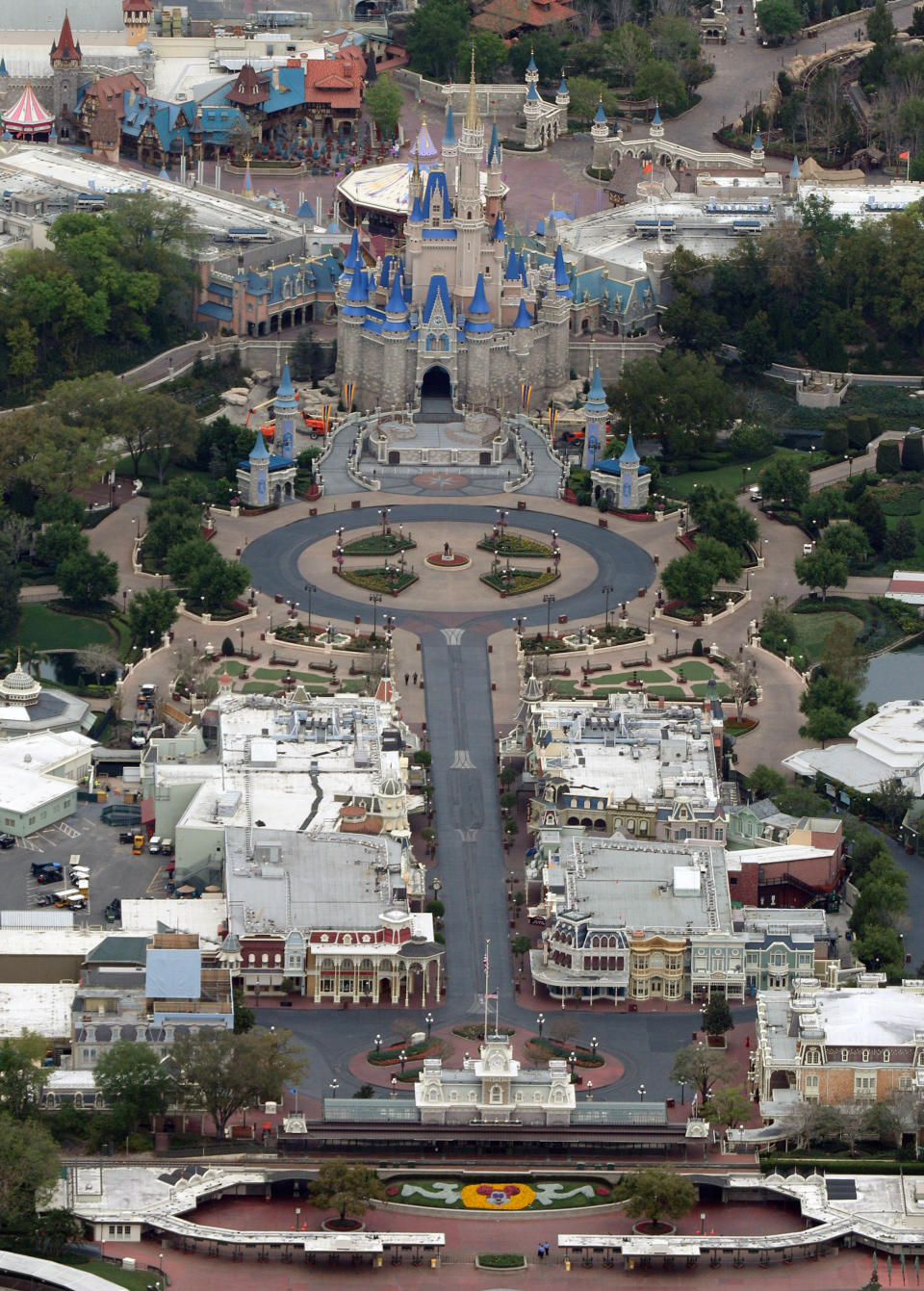 Cinderella Castle sits at the end of an empty Main Street at Disney's Magic Kingdom theme park after it closed in an effort to combat the spread of coronavirus disease (COVID-19), in an aerial view in Orlando, Florida, U.S. March 16, 2020.  REUTERS/Gregg Newton