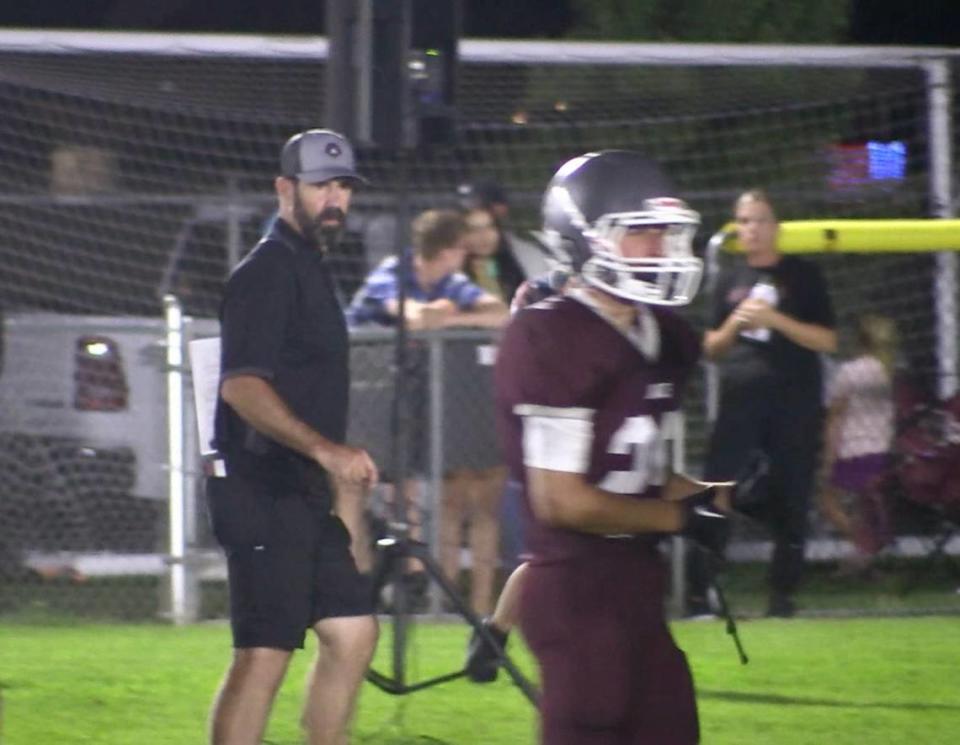 Fresno Christian coach Mick Fuller looks on from the sideline during a game against Mammoth on Friday, Aug. 18, 2023. The Eagles won 34-6.