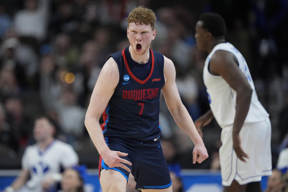 Duquesne forward Jakub Necas (7) celebrates after a three-point basket against BYU in the first half of a first-round college basketball game in the NCAA Tournament, Thursday, March 21, 2024, in Omaha, Neb. (AP Photo/Charlie Neibergall)