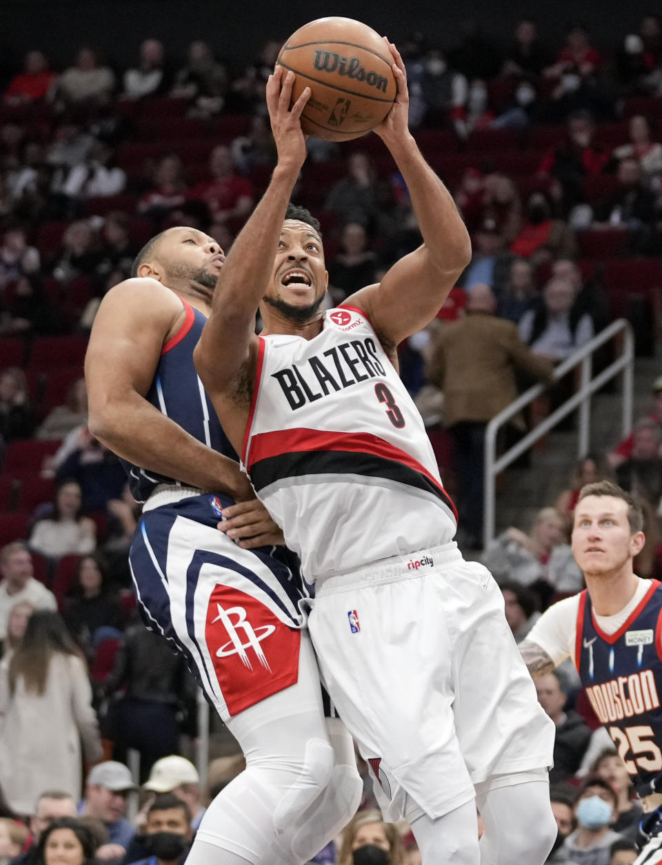 Portland Trail Blazers guard CJ McCollum (3) drives to the basket as Houston Rockets guard Eric Gordon defends during the first half of an NBA basketball game, Friday, Jan. 28, 2022, in Houston. (AP Photo/Eric Christian Smith)