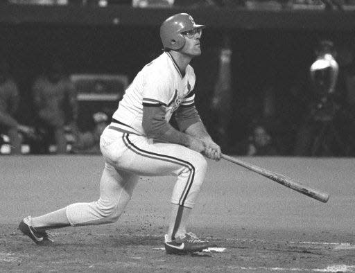 St. Louis Cardinals' Darrell Porter watches his fourth-inning two-run homer clear the fence in Game 6 of the World Series at Busch Stadium in St. Louis, Mo., on Oct. 19, 1982. The Cardinals won 13-1. Porter was named Most Valuable Player of the 1982 World Series. (AP Photo)