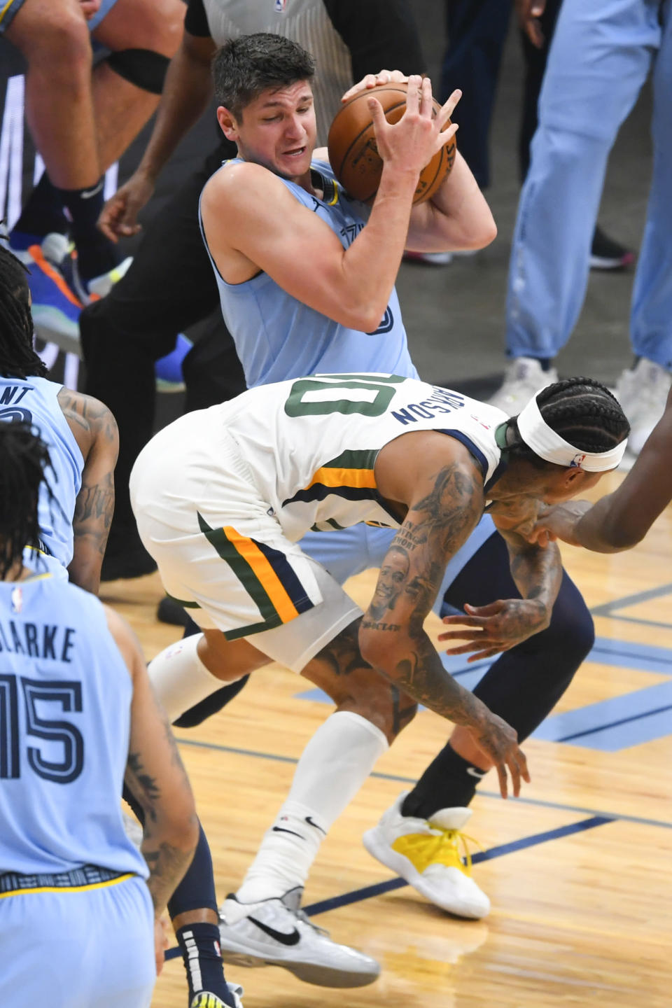 Memphis Grizzlies guard Grayson Allen tries to keep the ball from Utah Jazz guard Jordan Clarkson during the first half of Game 3 of an NBA basketball first-round playoff series Saturday, May 29, 2021, in Memphis, Tenn. (AP Photo/John Amis)