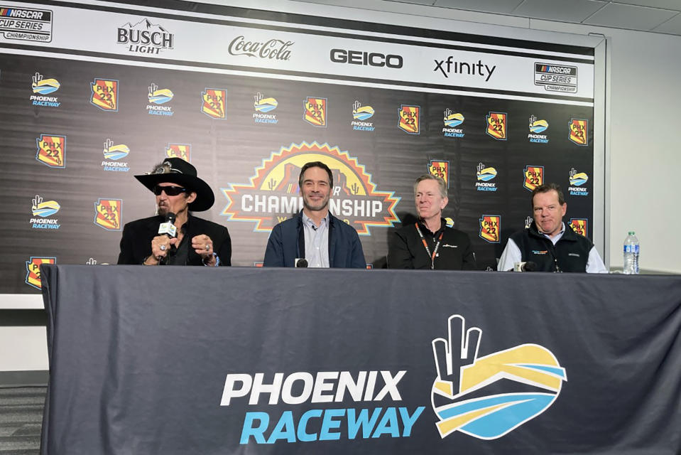 Richard Petty, Jimmie Johnson, Maury Gallagher, and Petty GMS team president Mike Beam, from left, are shown at a press conference at Phoenix Raceway in Avondale, Ariz., Friday, Nov. 4, 2022. Jimmie Johnson's NASCAR retirement and IndyCar experiment lasted all of two seasons. The seven-time NASCAR champion is returning in 2023 to the series that made him a global motorsports star as the part-owner of Petty GMS. (AP Photo/Jenna Fryer)