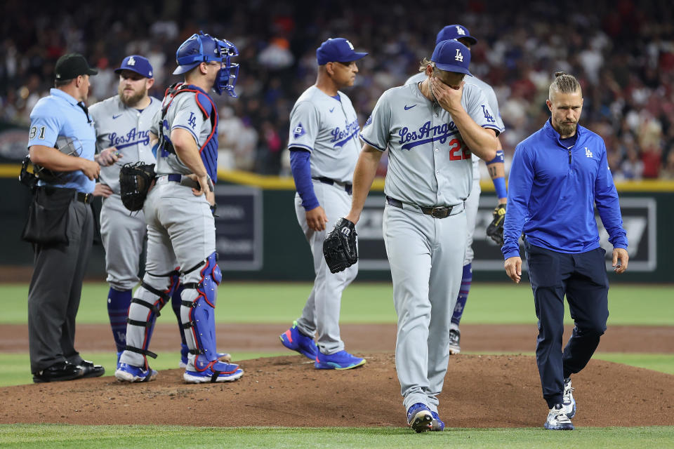 PHOENIX, ARIZONA - AUGUST 30: Starting pitcher Clayton Kershaw #22 of the Los Angeles Dodgers reacts after being removed by manager Dave Roberts #30 during the second inning of the MLB game against the Arizona Diamondbacks at Chase Field on August 30, 2024 in Phoenix, Arizona. (Photo by Christian Petersen/Getty Images)