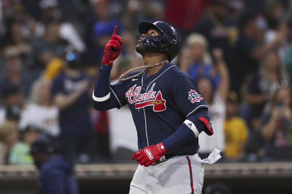 Atlanta Braves' Jorge Soler gestures to the sky as he nears home plate after hitting a three run home run against the San Diego Padres in the sixth inning of a baseball game Saturday, Sept. 25, 2021, in San Diego. (AP Photo/Derrick Tuskan)