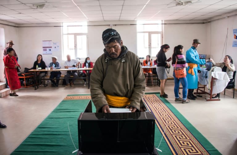 A man casts his vote in Mandalgovi in the Gobi desert, Mongolia on June 29, 2016