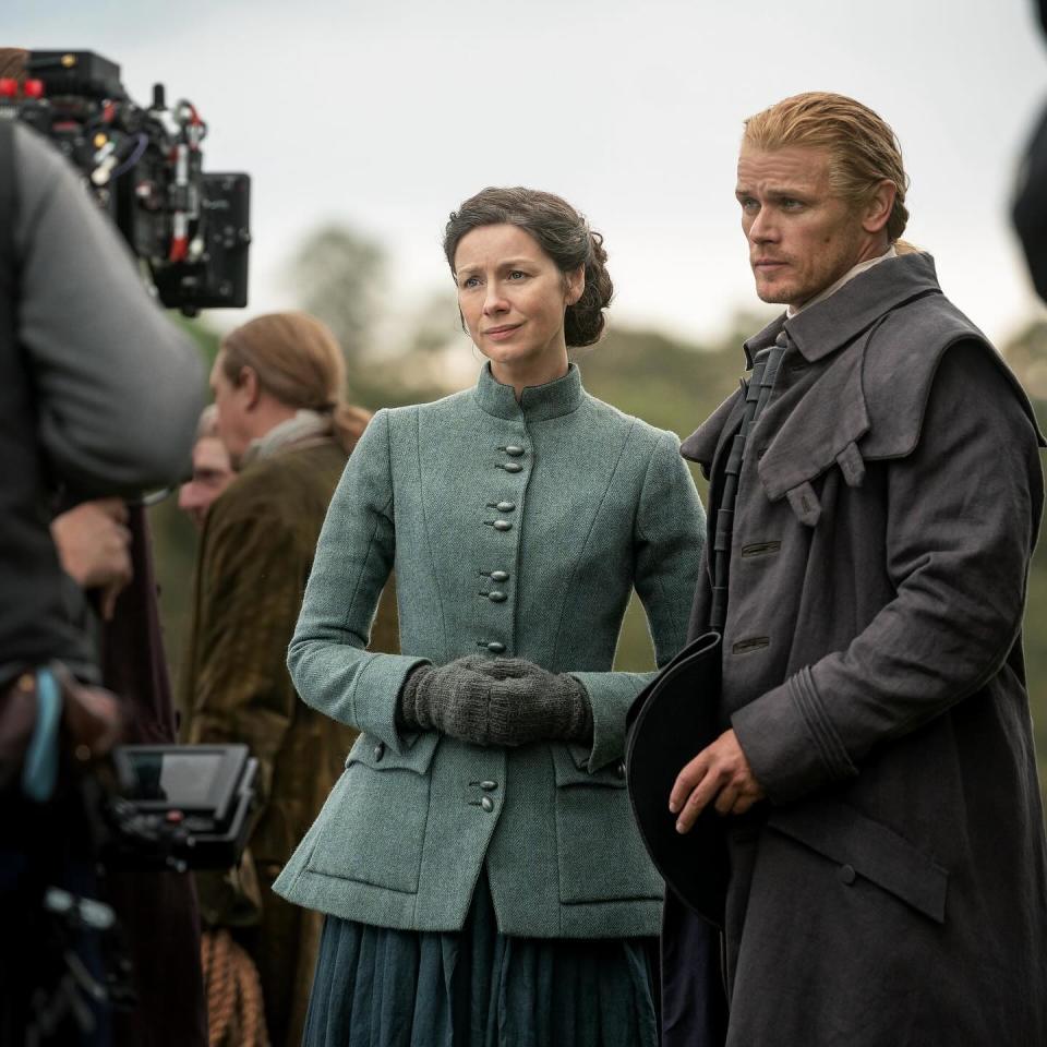 Claire Fraser (Caitríona Balfe) and Jamie Fraser (Sam Heughan) in a behind-the-scenes shot of "Outlander" season seven.