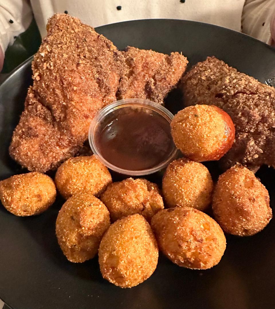 Tender breaded chicken thighs with hush puppies and barbecue sauce is another special served with coleslaw or a house salad at Tozzi's Restaurant of Magnolia.