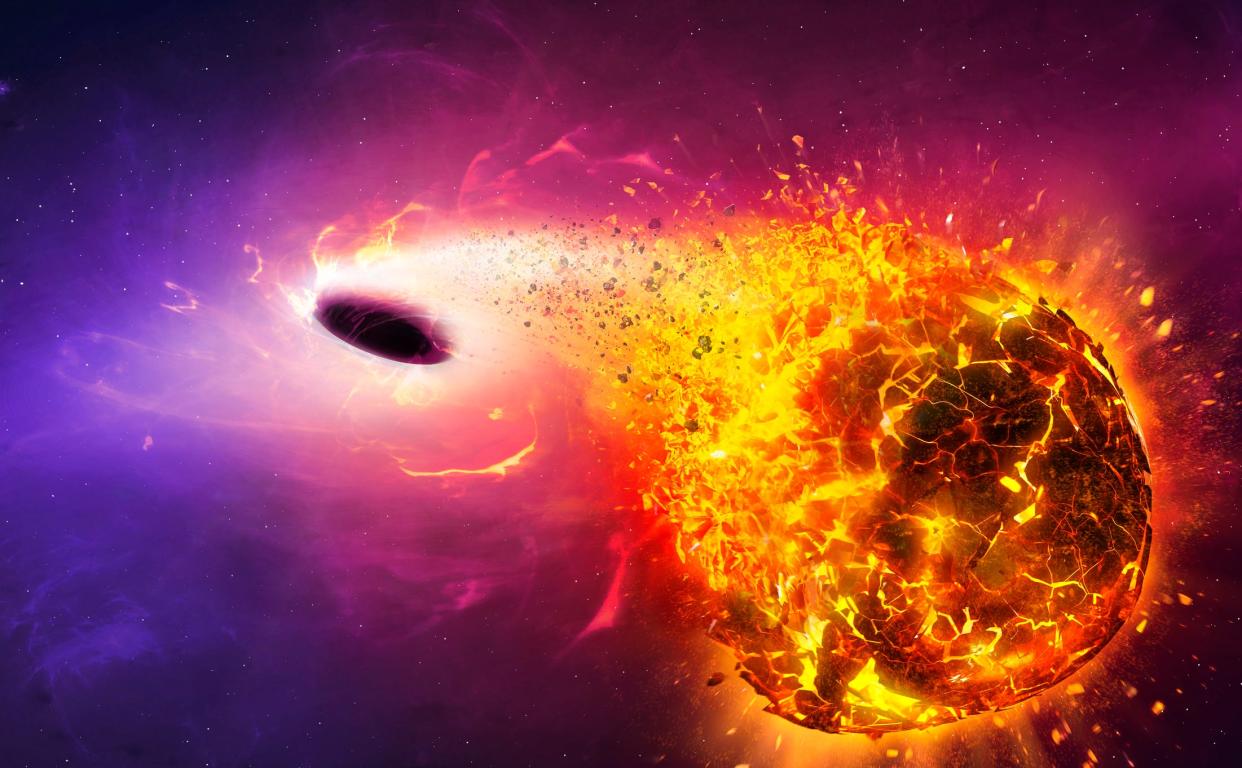 Illustration of a black hole obliterating a planet.