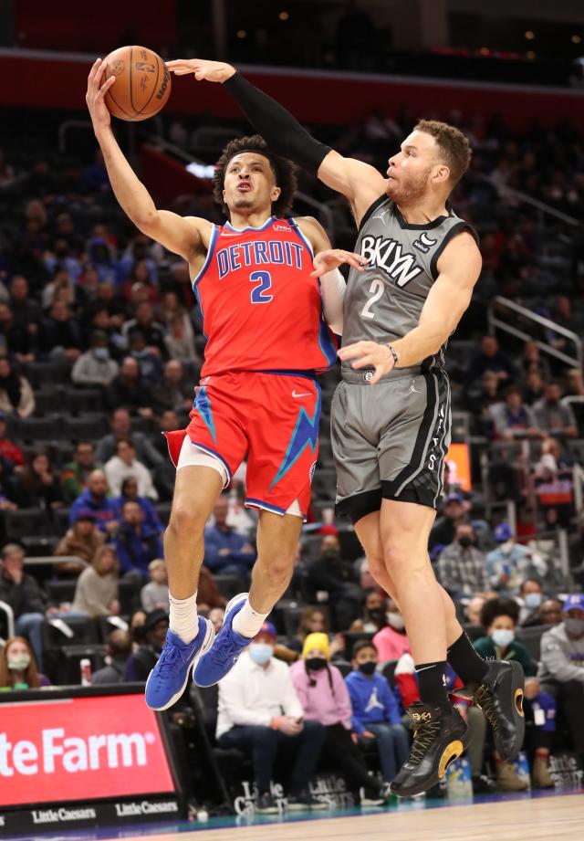 Pistons guard Cade Cunningham shoots against Nets forward Blake Griffin on Sunday, Dec. 12, 2021, at Little Caesars Arena.