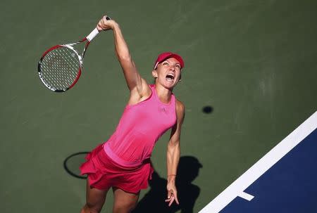 Simona Halep of Romania serves to Mirjana Lucic-Baroni of Croatia during their match at the 2014 U.S. Open tennis tournament in New York, August 29, 2014. REUTERS/Adam Hunger