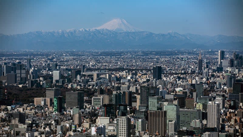 Mount Fuji is viewed clearly through the cool winter air, Friday, Jan. 29, 2021, in Tokyo.