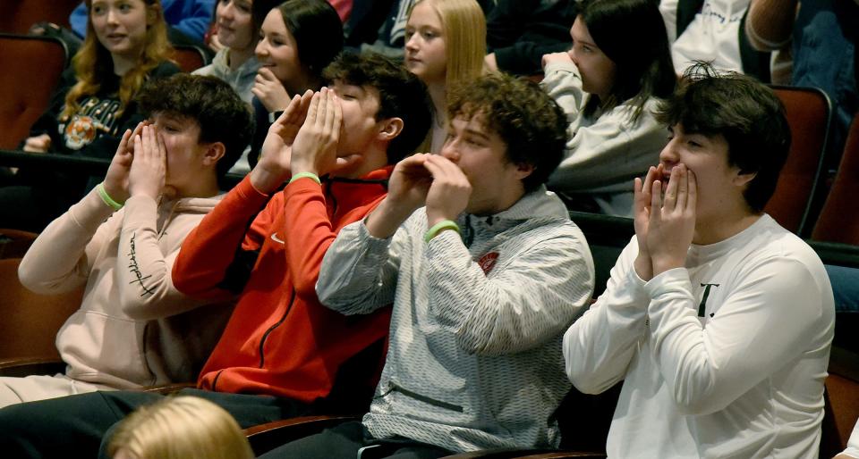 Monroe High School freshman Landon Loveland, senior Lukas Johnson, senior Logan Loveland and St. Mary Catholic Central senior Jaden Paquette cheer on their classmates taking part in the "Slay the Day, Don't Waste it Away" games at Tuesday's #iMatter Youth Summit at Monroe County Community College. About 400 students attended.