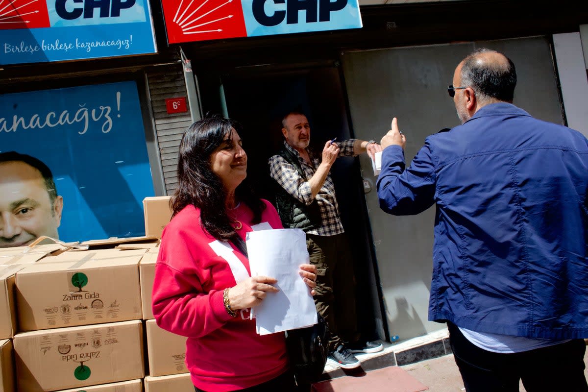 Opposition party official Cigdem Gulduval helps organize meals for poll workers (Yusuf Sayman/ The Independent)