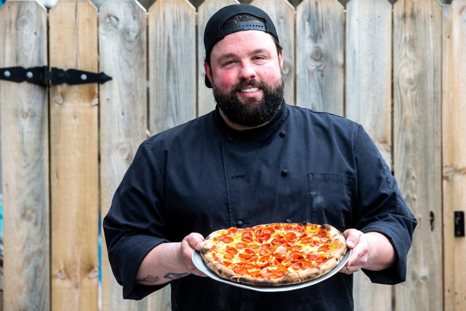 Robbie Jester, owner of Pizzeria Mariana, displays his pepperoni pizza at his restaurant in Newark on Thursday, Jan. 12, 2023. Jester participated in the Netflix series "Pressure Cooker," a reality cooking competition show.